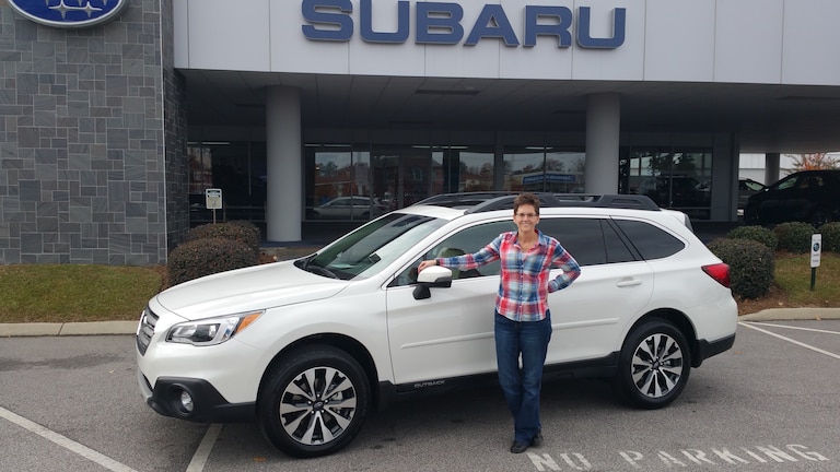 Ms. Trudy with her first Subaru - a 2017 Outback!.jpg