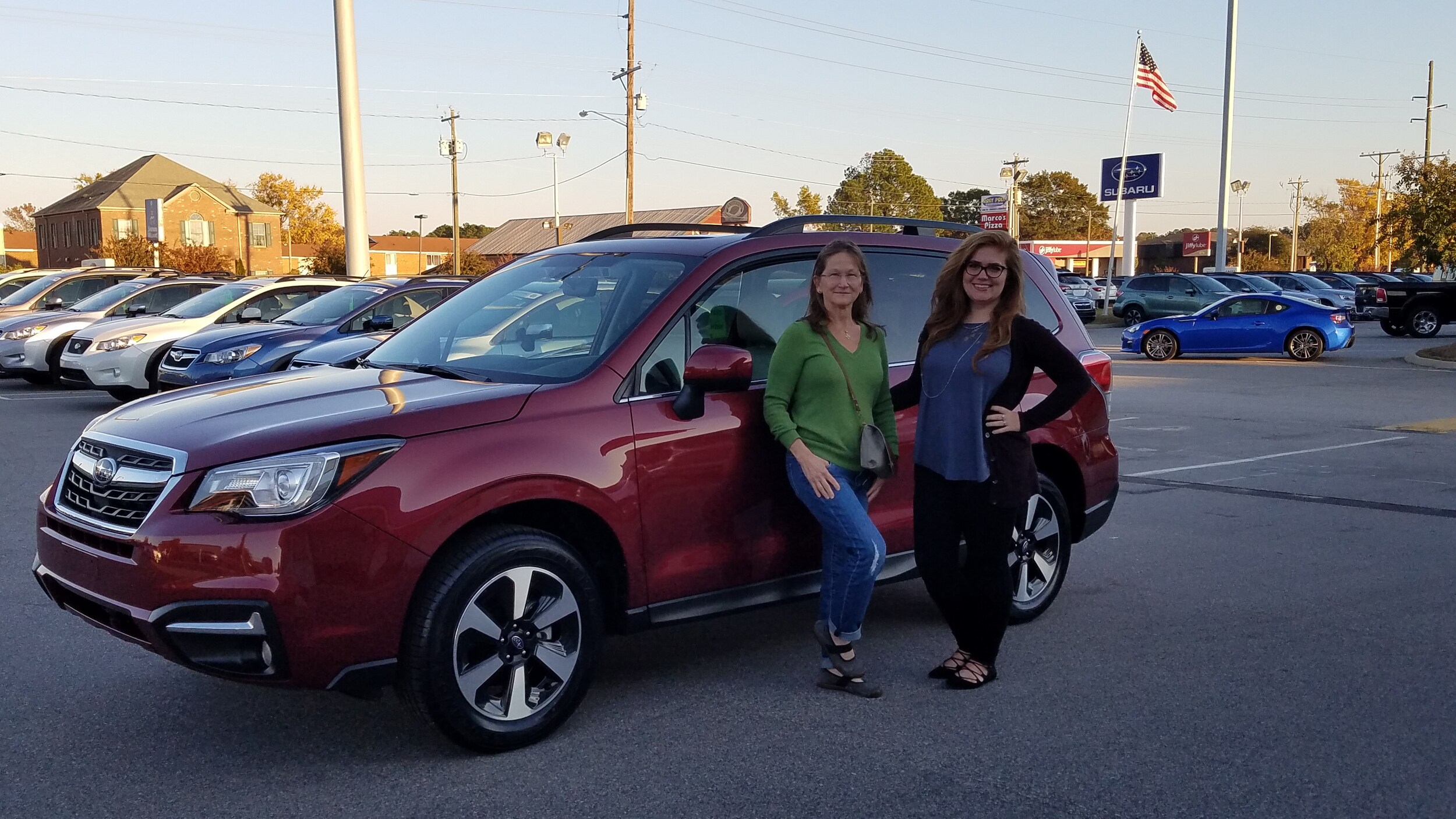 Theresa and Senior Sales Advisor with her new 2017 Forester.jpg