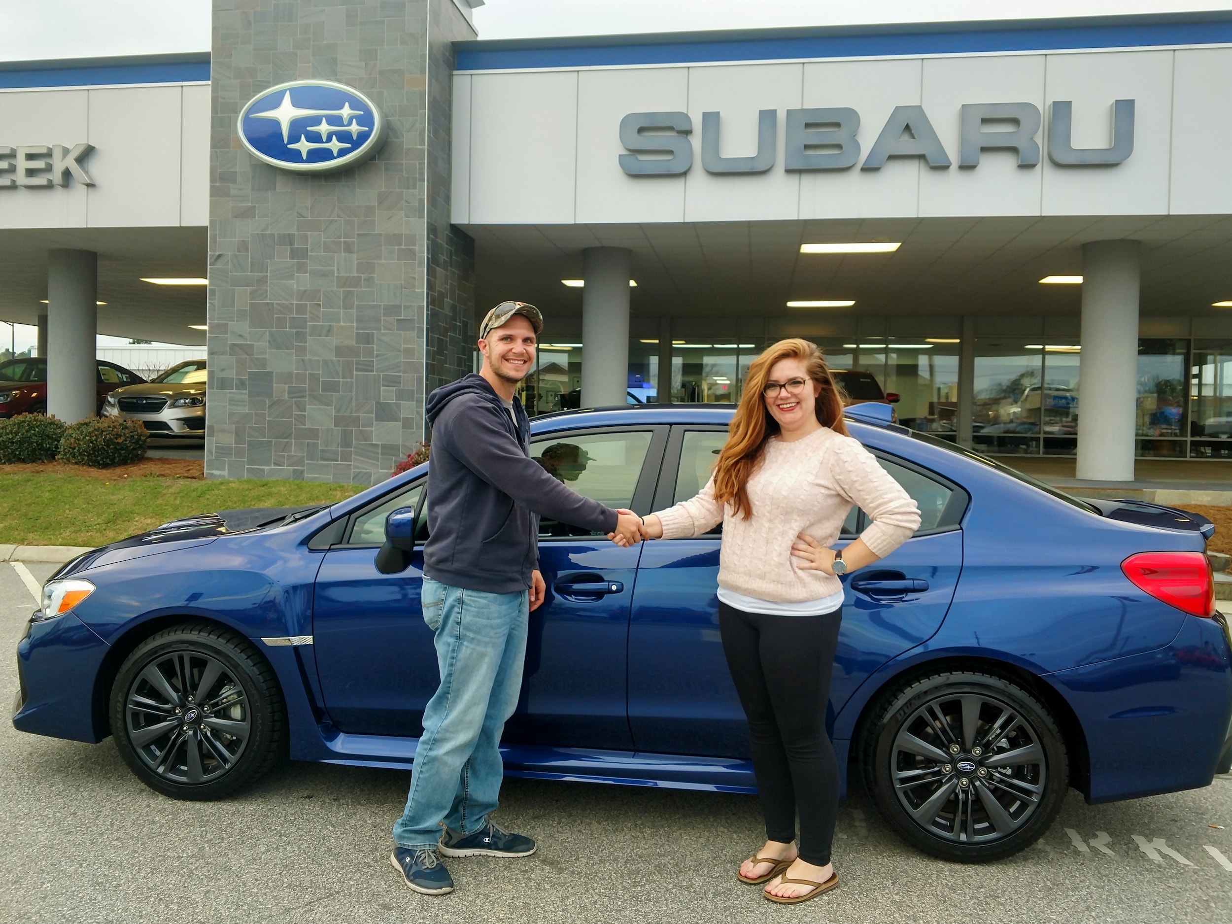 Jeremy shakes Sr Sales Advisor Emily's hand.jpg