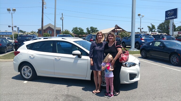 Nellie, her daughter Susan, and granddaughter, Molly, in front of her new 2017 Impreza!.jpg