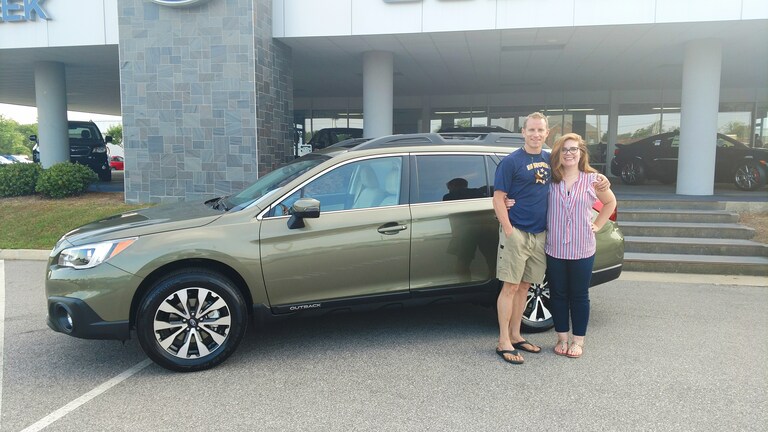 Mr Brinker with Sr Sales Advisor Emily in front of his new 2017 Subaru Outback.jpg