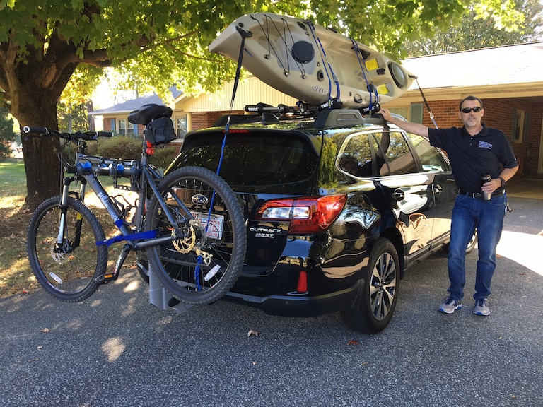 Greg Benge with his Outback ready for an outdoor adventure day.JPG