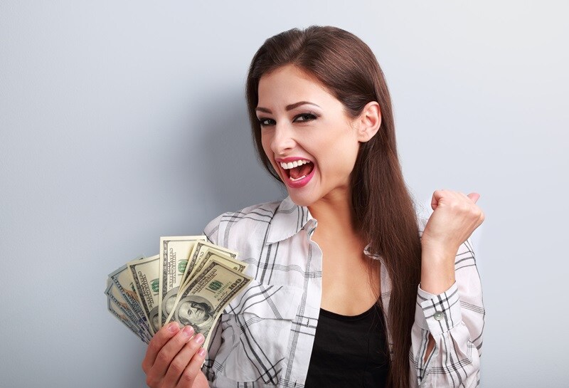 happy girl holding cash money