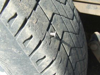Why is my tire losing air? nail pokes hole in tire