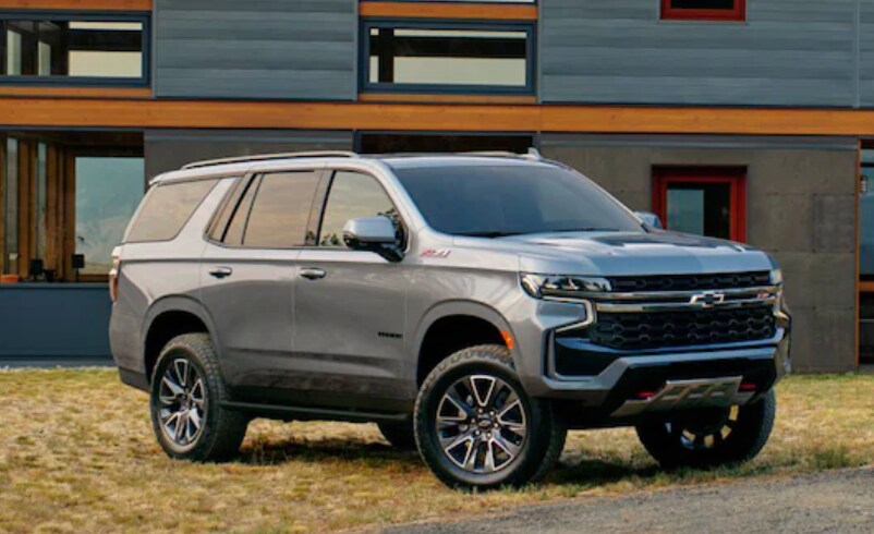 Cheyv Tahoe.PNG 2023-chevy-tahoe-parked-in-fornt-of-modern-house