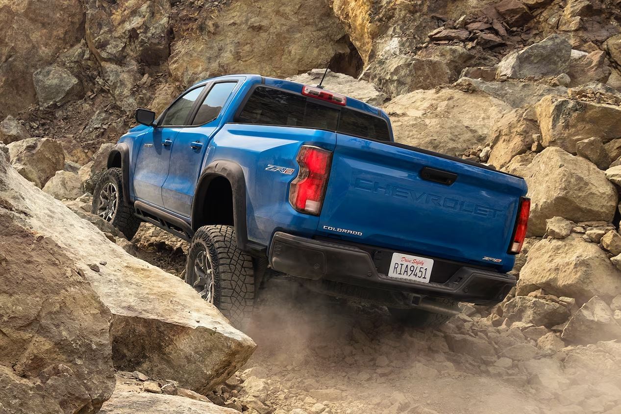 Chevy Colorado 2024.JPG A New Chevy Colorado driving off road over a boulder field.