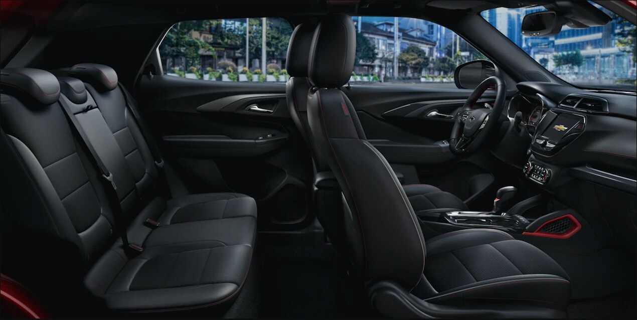 2023-Chevy-Trailblazer-5.PNG The interior cabin and seating of a 2023 Chevy Trailblazer upholstered in black leather with red accents