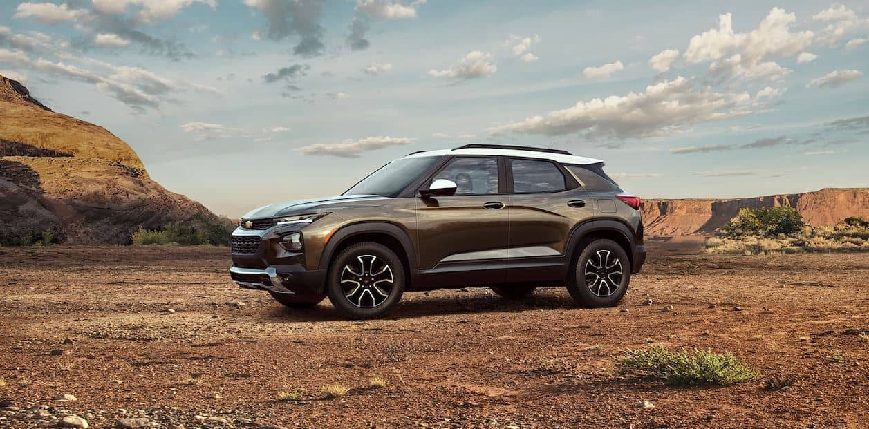 2022 Chevy Trailblazer A 2022 Chevy Trailblazer SUV parked in a rural clearing with a canyon in the background