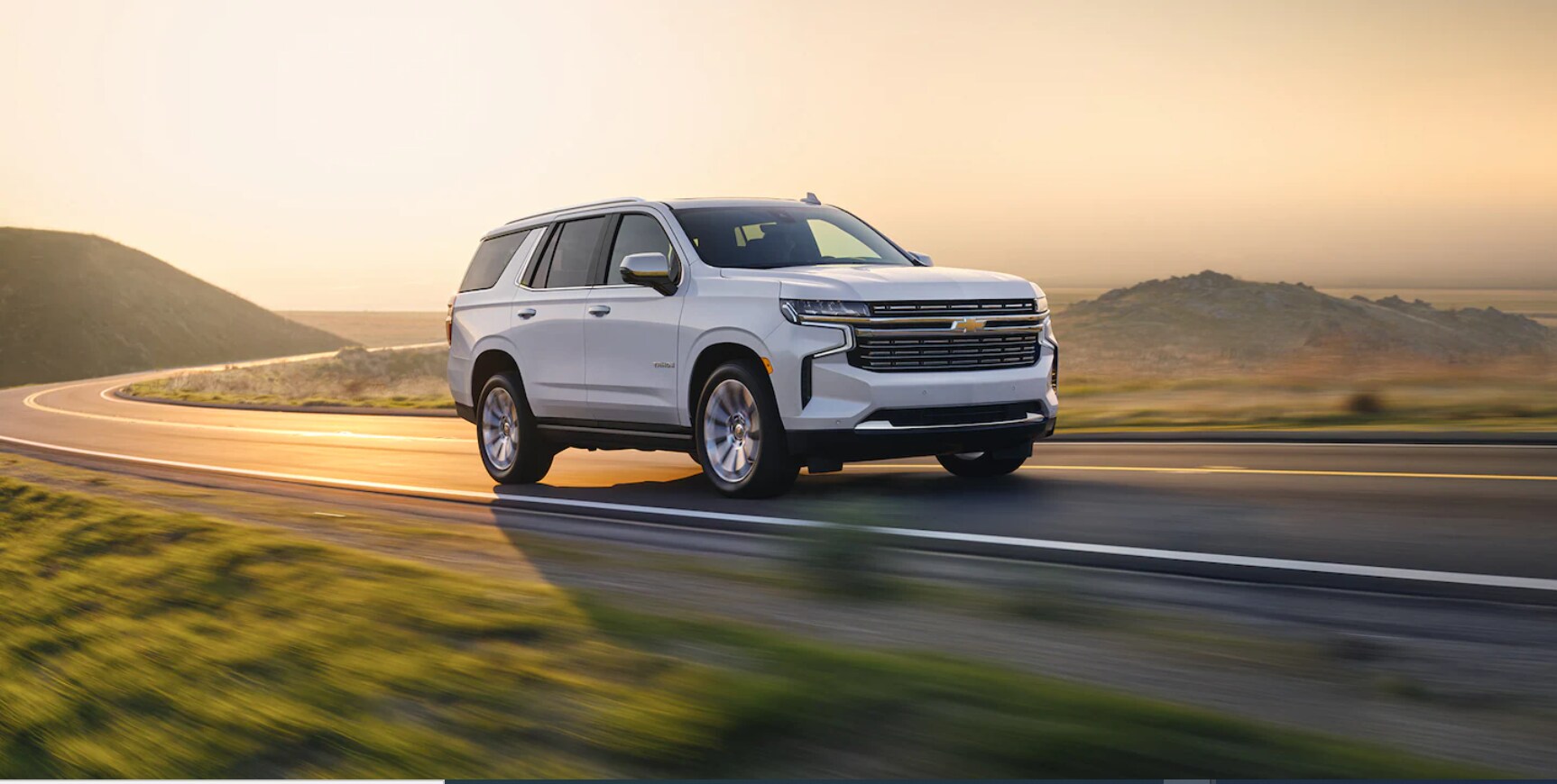 2022-Chevy-Tahoe-02.png New Chevy Tahoe driving in the sunset