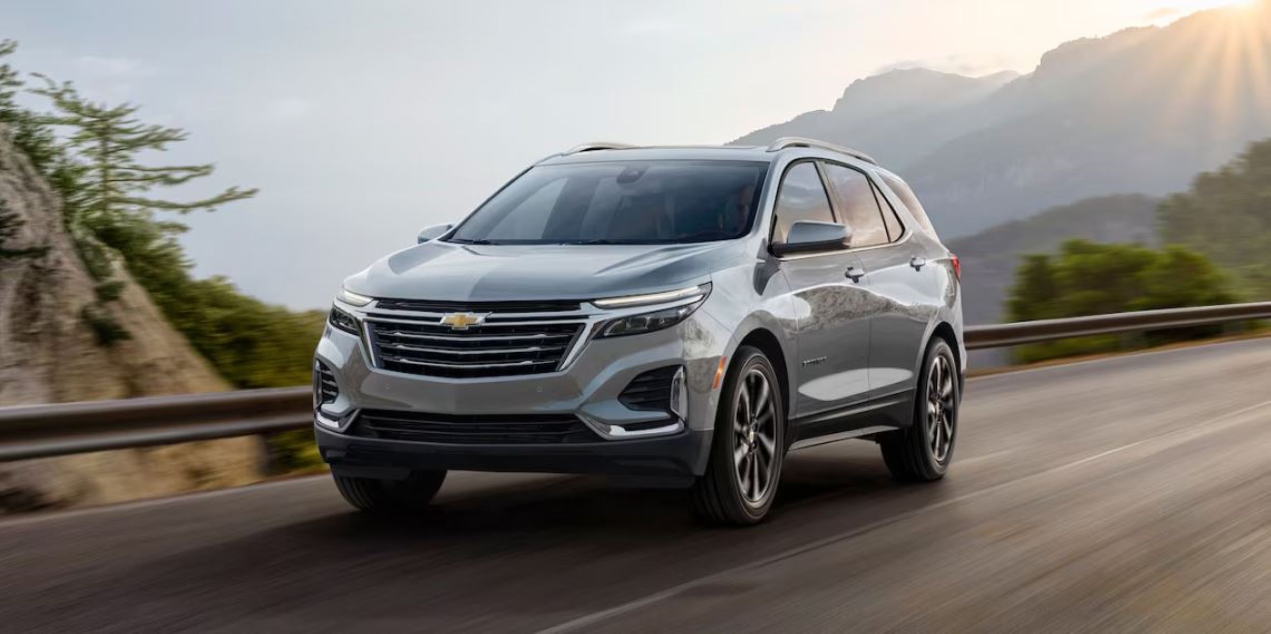Equinox Silver 20242.JPG A silver Chevy Equinox driving down a windy road