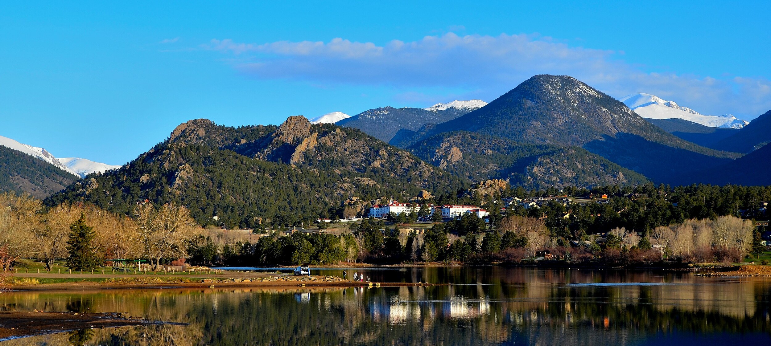 AdobeStock_132381461.jpeg A view of the Stanley Hotel from a lake in Estes Park.
