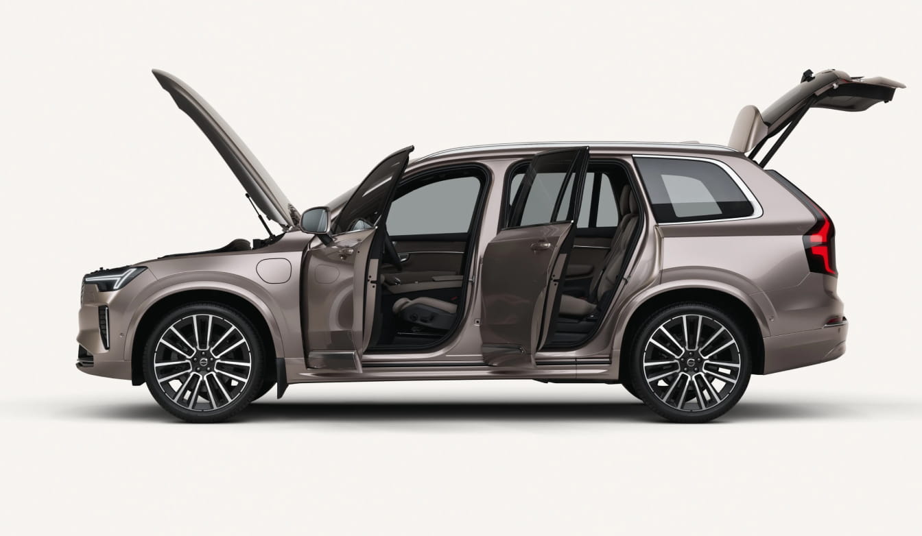 Volvo XC90 Plug-In Hybrid shown in side profile with its hood, passenger doors, and rear liftgate open.