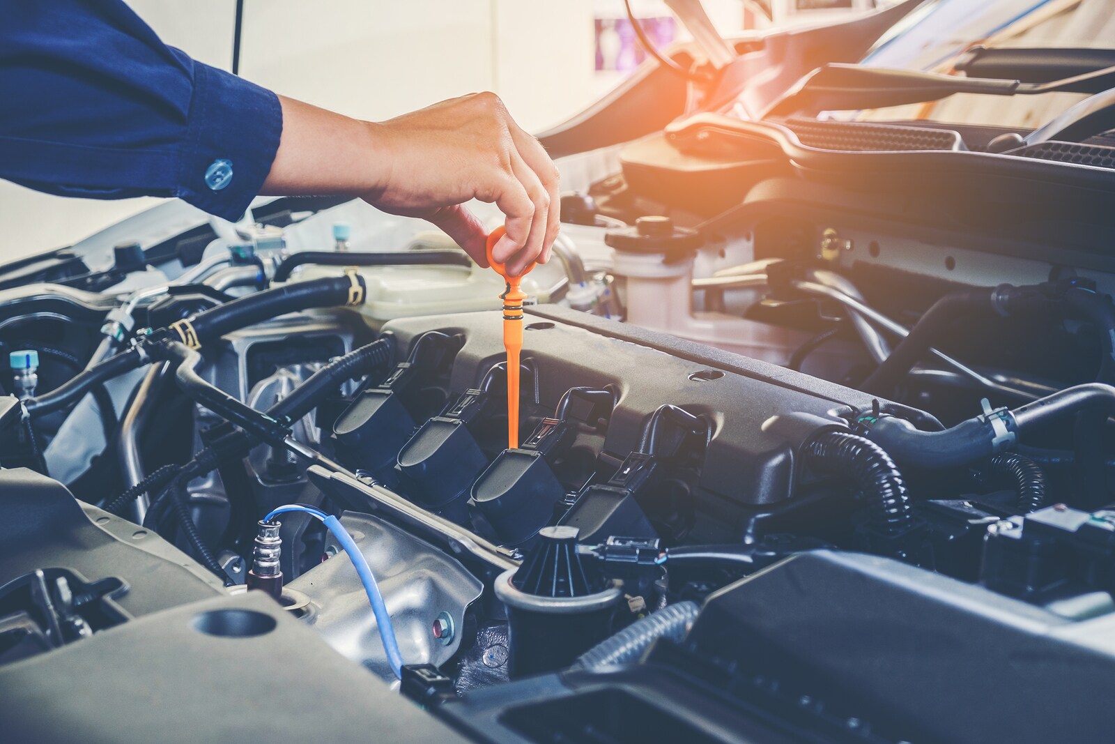 bigstock-Mechanic-Changing-Oil-Mechanic-191895544.jpg