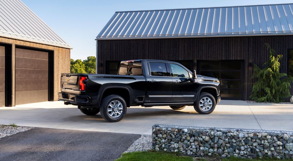 Chevy%20Silverado%202500%20for%20Sale%20-%202024%20Chevy%20Silverado%202500HD%20High%20Country%20-%20Garages.jpg A black 2024 Chevy Silverado 2500HD High Country is shown parked on a concrete driveway.