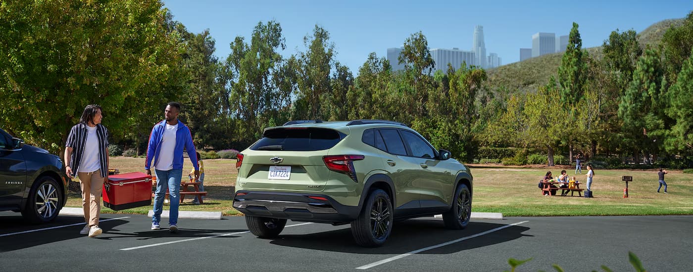 2025%20Chevy%20Trax%20ACTIV%20-%20Green%20Park.jpg A green 2025 Chevy Trax ACTIV parked near a grassy park.