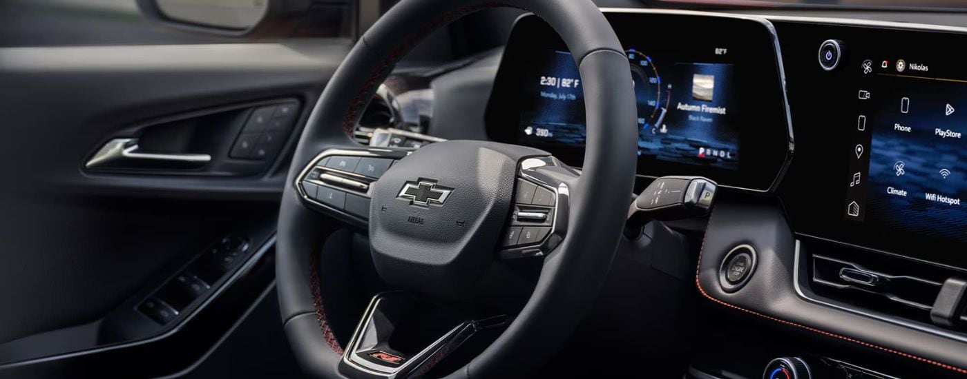 A close up shows the black steering wheel in a 2025 Chevy Equinox RS.
