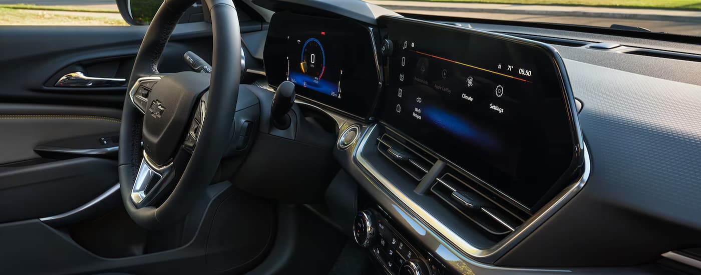 2025%20Chevy%20Trax%20-%20Dashboard.jpg The silver and black dashboard and infotainment screen in a 2025 Chevy Trax.