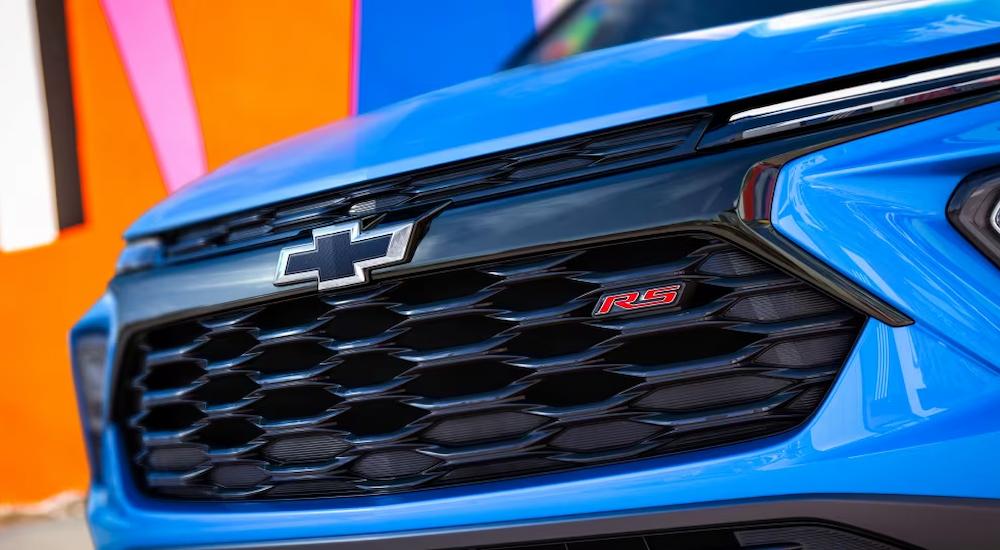 A close up of the grille of a blue 2024 Chevy Trailblazer RS is shown at a Gahanna Chevy dealer.