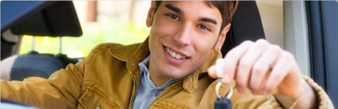 young_man_holding_key.jpg
