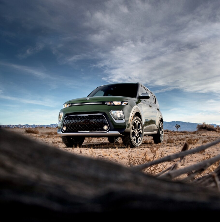 2021-KIA-Soul-XLine-SUV-01.png green Kia Soul parked in the desert, looking up at from below the front grill