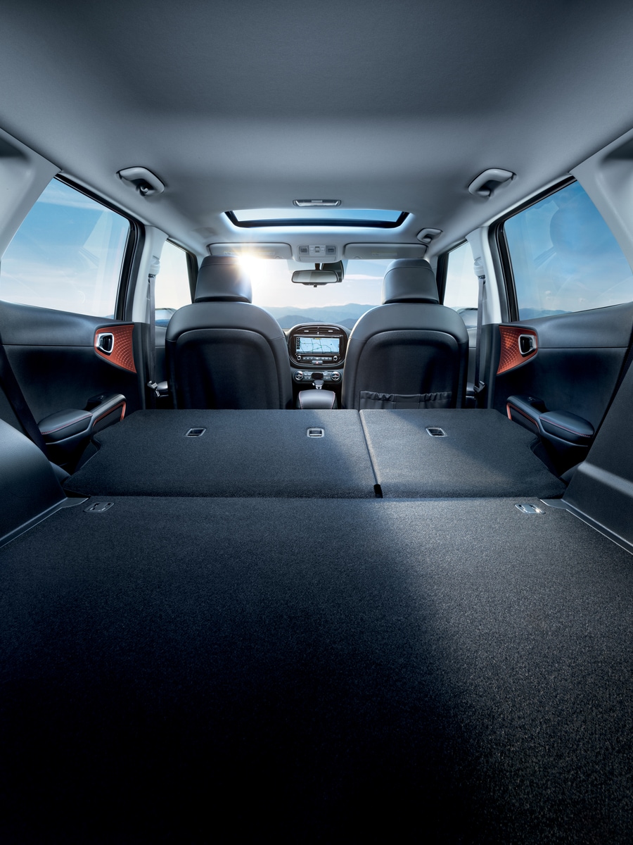 2022-KIA-Soul-GTLineTurbo-SUV-I01.png dark gray Kia Soul compact SUV interior, seats folded down