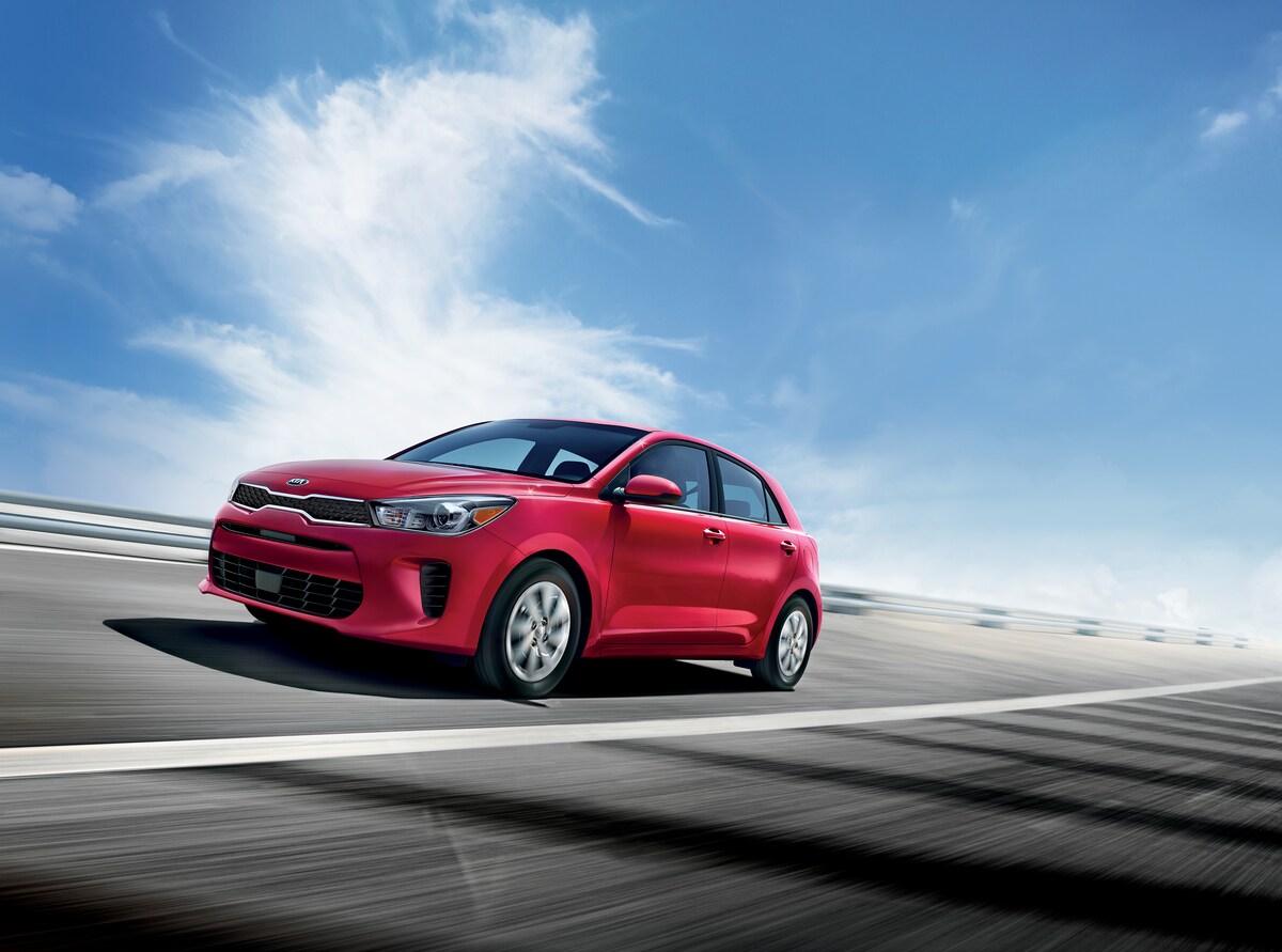 2020-KIA-Rio-S-Hatchback-L01.png red Kia Rio hatchback car racing around a track at an angle