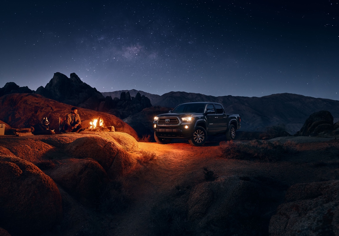 2023-Toyota-Tacoma-SR5-CrewMax-Truck-L02.png black Toyota Tacoma truck parked at a desert campsite