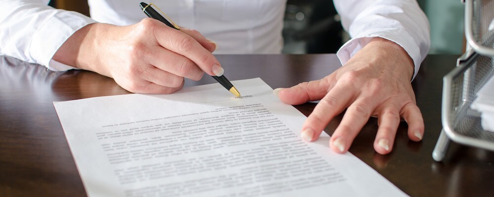 Signing a car loan agreement