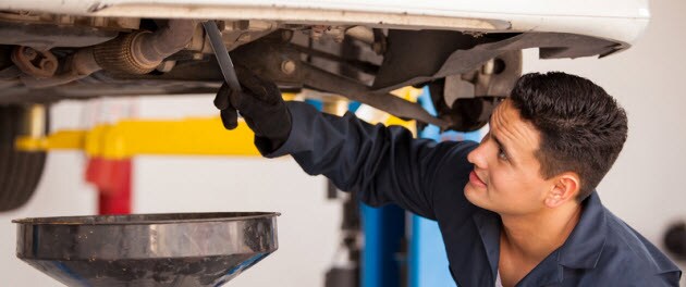 Service Tech Changing Oil Service Tech Changing Oil