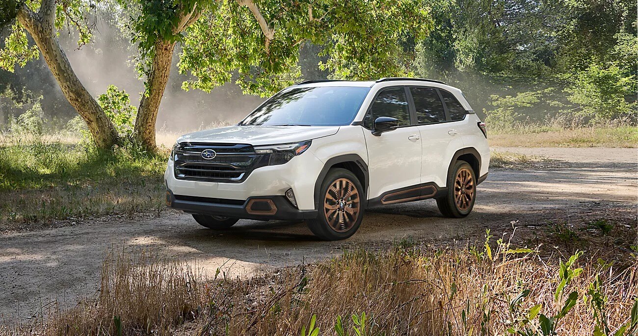 2025 Subaru Forester driving down dirt road