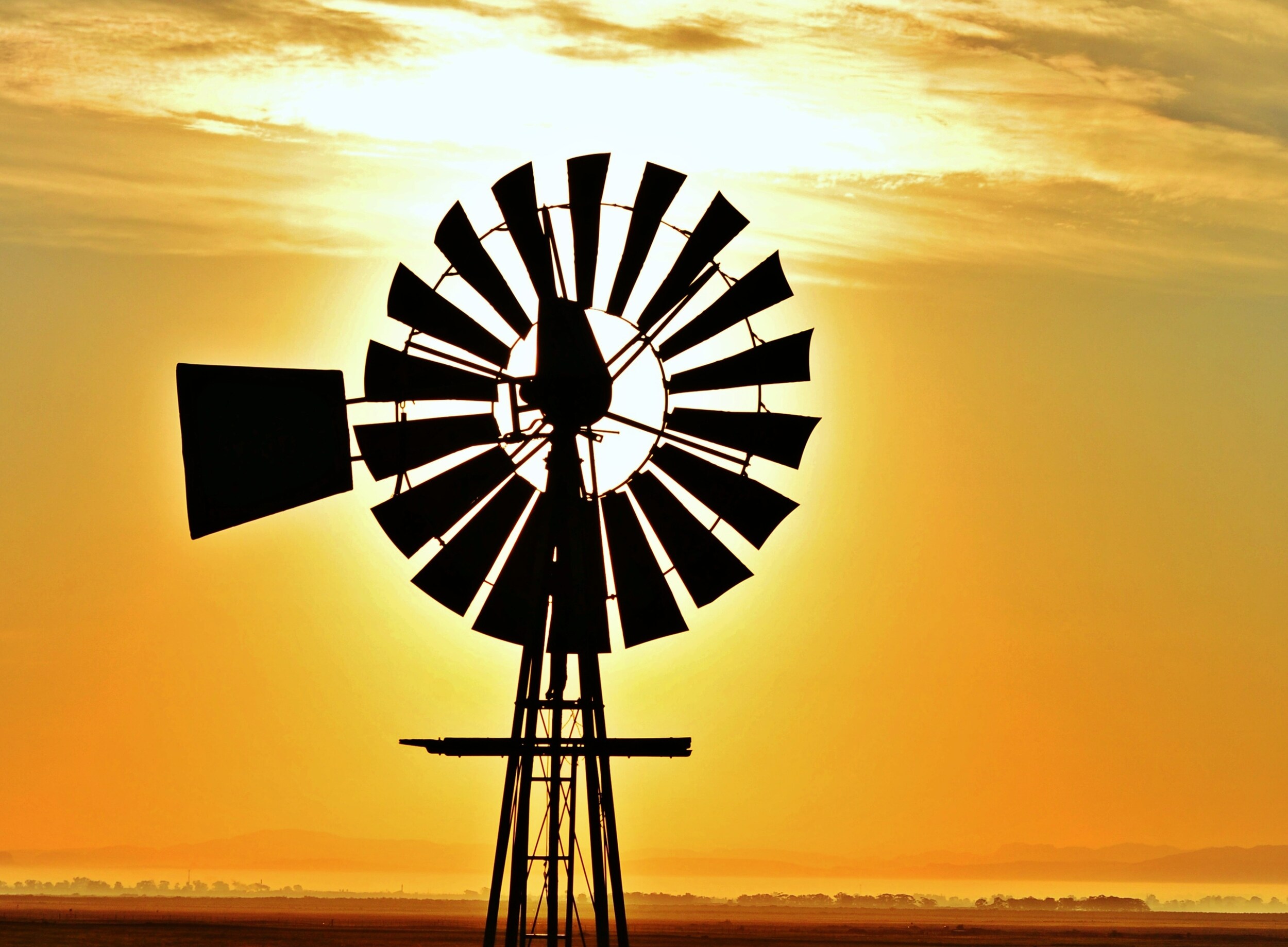 close-up-with-windmill-water-pump-beautiful-sunrise_3.png