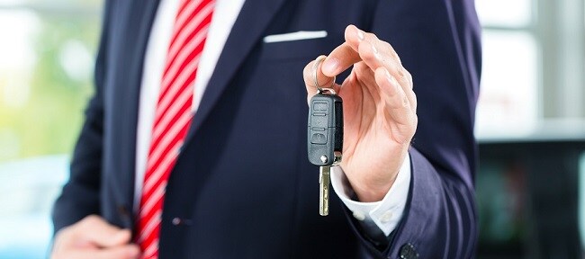 Salesman handing over keys banner DDC.jpg