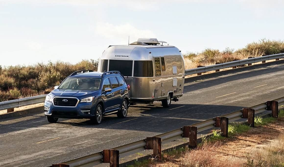 21 Ascent Towing.jpg blue Subaru Ascent SUV towing an Airstream trailer