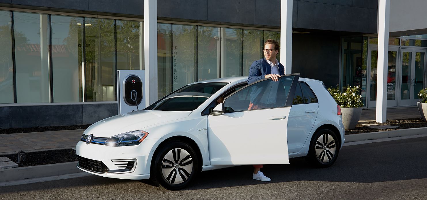 White eGolf with man.JPG