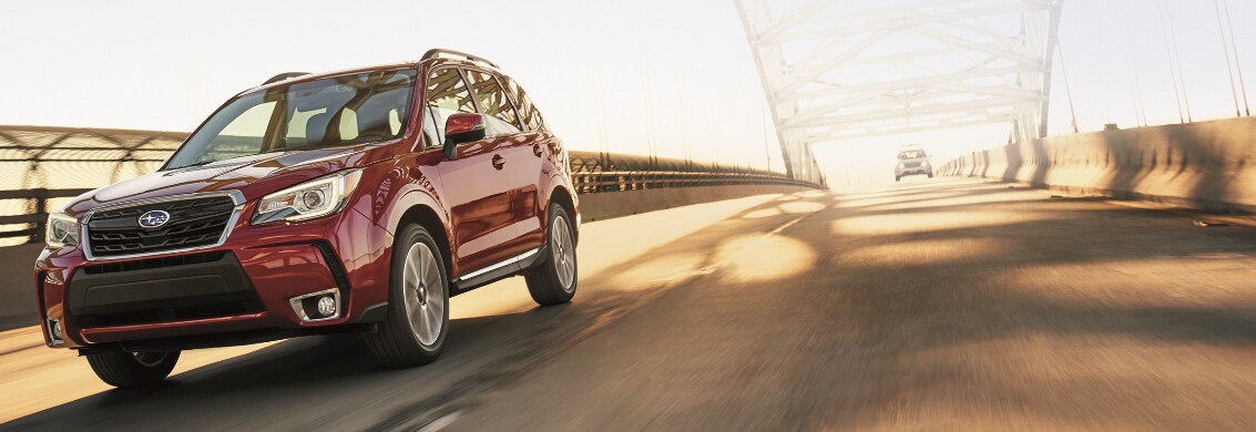 Subaru Forester driving over bridge