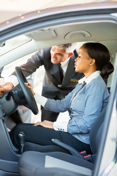 9 - dealershowingwomancarfeatures.jpg