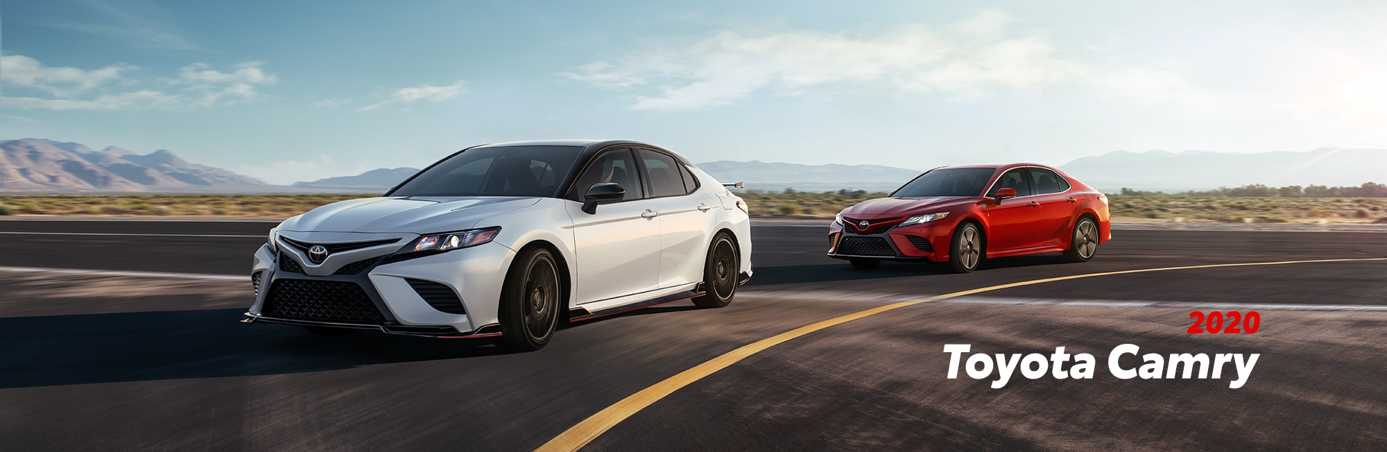 Model Features of the 2020 Toyota Camry at Johnstons Toyota of New Hampton | Two 2020 camry racing on the street