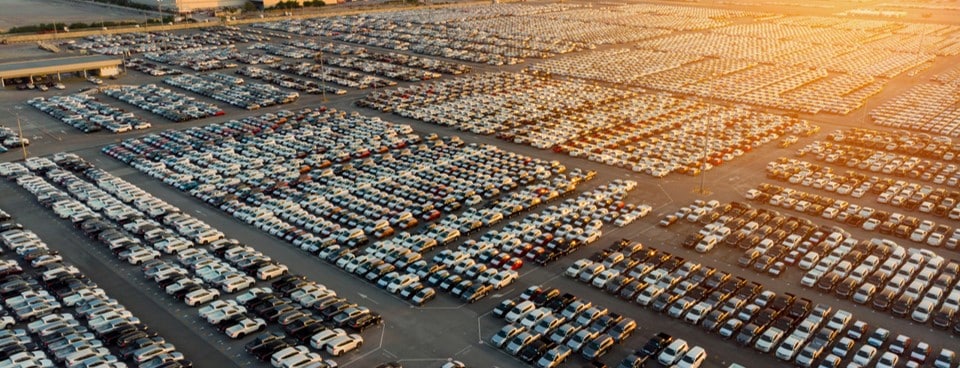 busy car lot with trucks.jpg