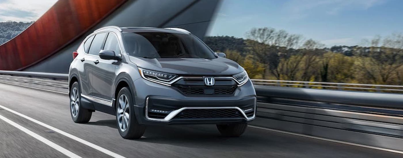 A grey 2020 Honda CR-V Hybrid is shown from the front at an angle.