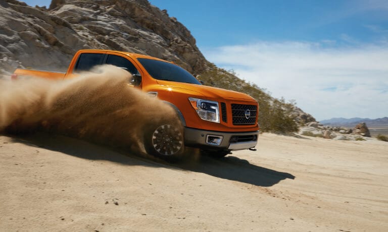 19TitanXD_DrivingWithDustFlyingUp_5x3