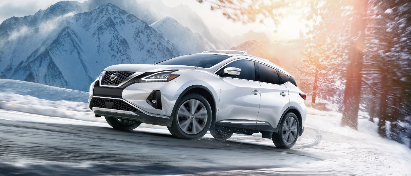 2020 Nissan Murano A white 2020 Nissan Murano driving through the snowy mountains