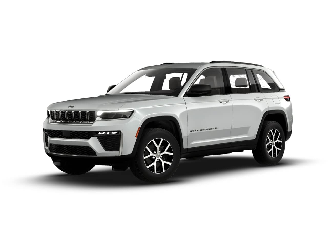 Front three-quarter view of a Silver Zynith Jeep Grand Cherokee on a white background.