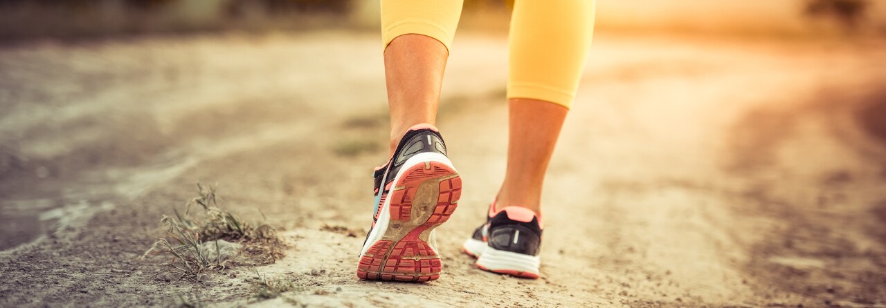 woman walking on trail