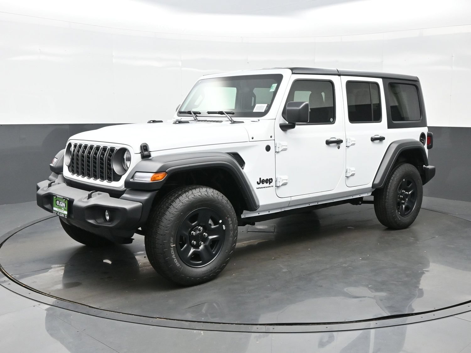 2026 Jeep Wrangler 4-Door Sport in Bright White, front three-quarter view