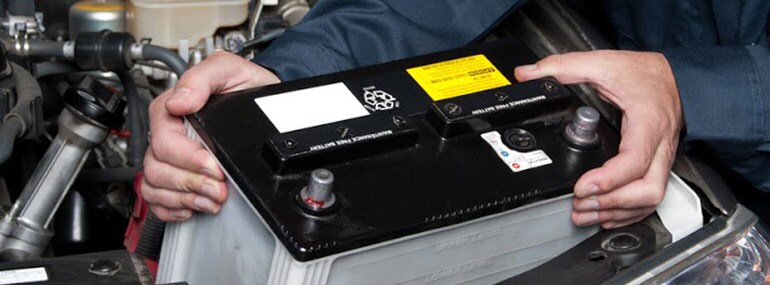 Auto-mechanic-replacing-car-battery_7452786_s.jpg
