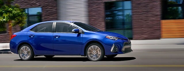 2018 Toyota Corolla shown in Blue Crush Metallic with available Premium Package.