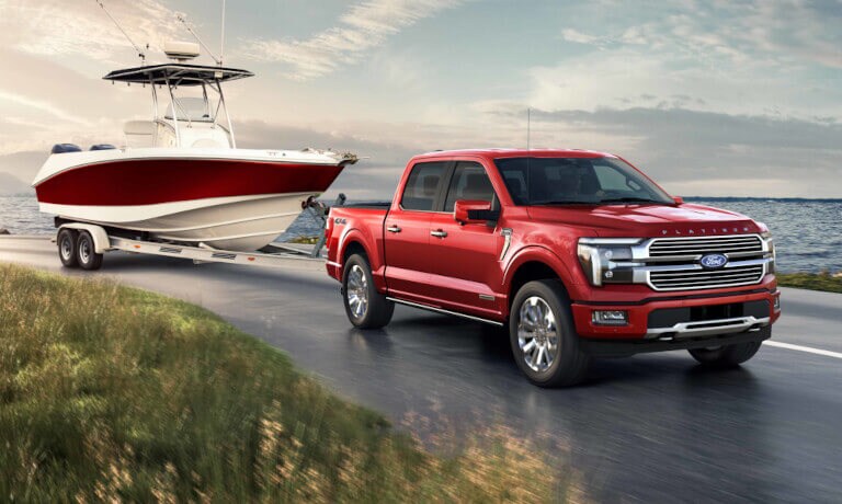 2024 Ford F-150 Exterior Towing A Boat By Lake