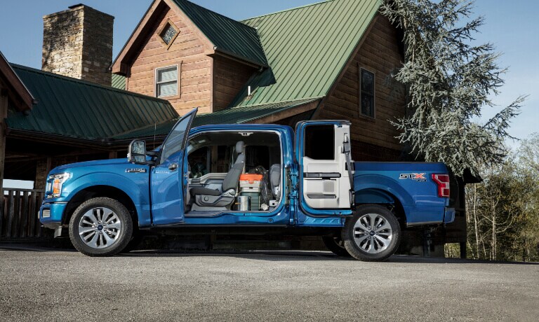 2020 Ford F-150 exterior side view with doors open to reveal interior cab