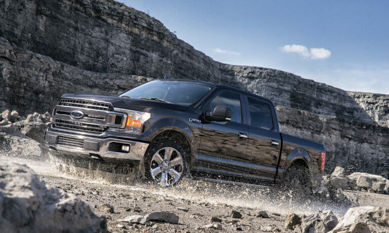 2020 Ford F-150 exterior driving on rocky canyon