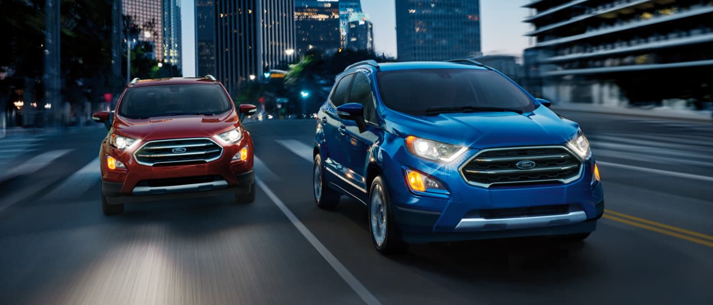 2020 Ford EcoSport exterior two driving side by side in city at night